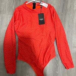 Bodysuit with tag - has padding - gifted to me